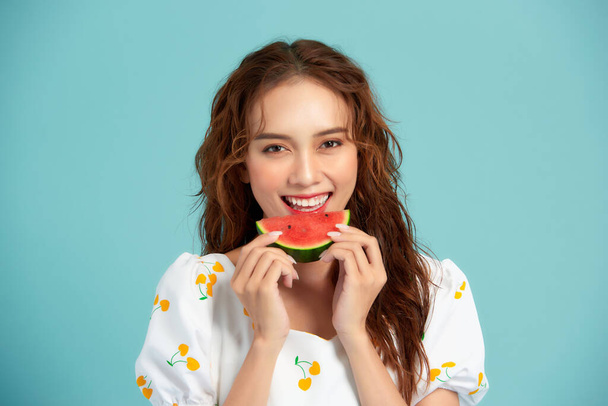 Portrait happy young Asian woman is holding slice of watermelon, funny and happiness concept - Φωτογραφία, εικόνα