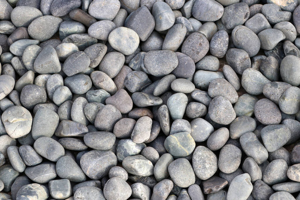 Motif de galets ronds en pierre. Contexte de la roche de la rivière cailloux. - Photo, image