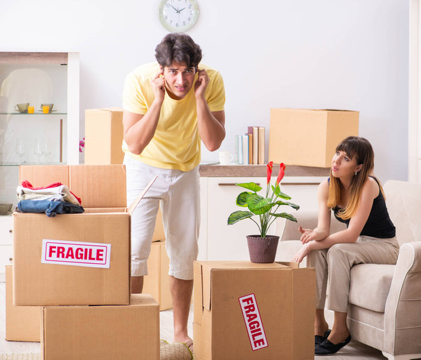 Young couple moving to new flat with fragile things - Photo, Image