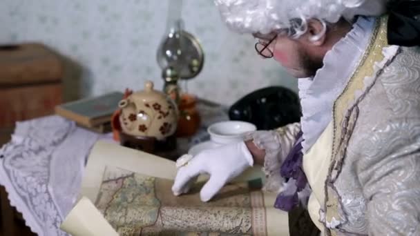 19th century man exploring an old geographical map - Footage, Video