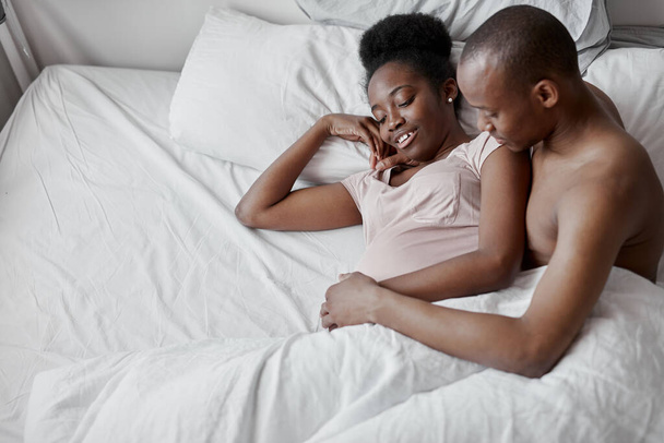 beautiful young married couple lie on bed in the morning together - Photo, Image