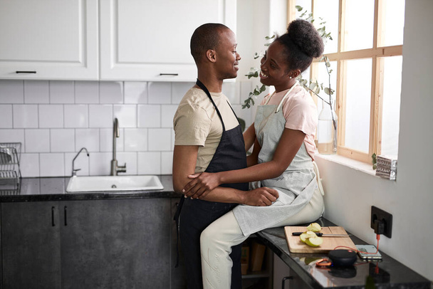 beautiful young couple have rest in the kitchen - Fotó, kép