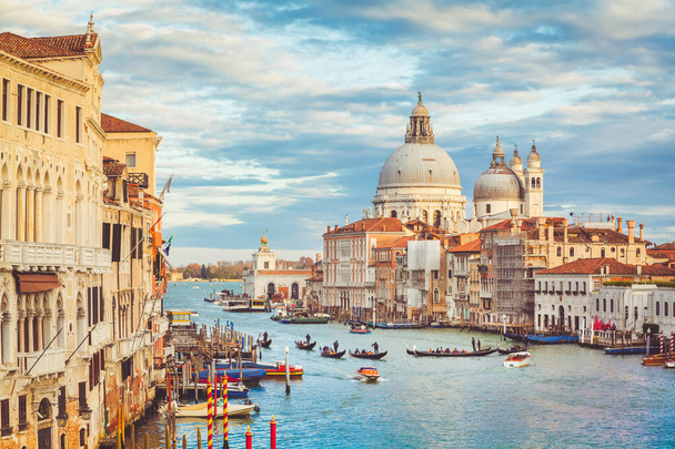 Classic panoramic view of famous Canal Grande with scenic Basilica di Santa Maria della Salute in beautiful golden evening light at sunset with retro vintage filter effect, Βενετία, Ιταλία - Φωτογραφία, εικόνα