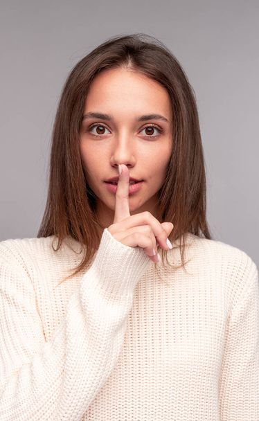 Young woman making silence gesture - Photo, Image