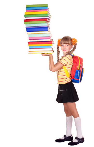 Schoolgirl with backpack holding pile of books. - Foto, Imagem