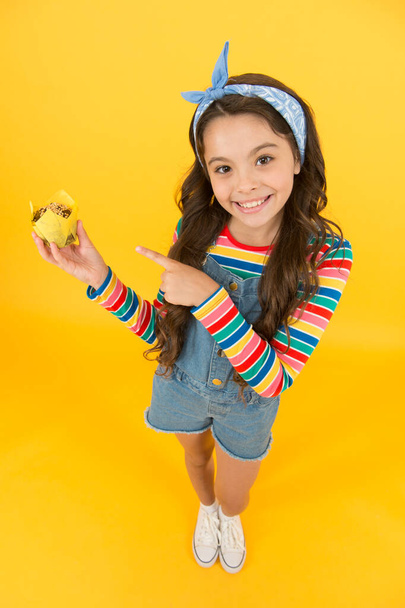 Sweet yummy muffin small girl, charming sweet tooth concept - Фото, зображення