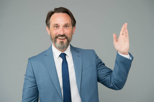 Businessman smiling mature man waving hand, welcoming clients concept - Fotoğraf, Görsel