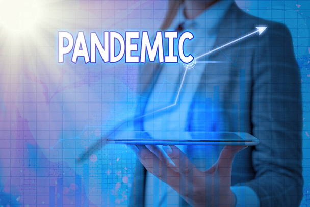 Handwriting text Pandemic. Concept meaning occurring over a wide area affecting high proportion of population Arrow symbol going upward denoting points showing significant achievement. - Photo, Image