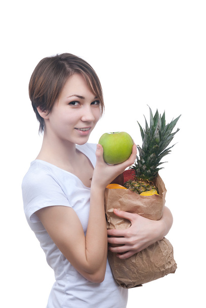 lány csomag-a gyümölcs és a zöld alma - Fotó, kép