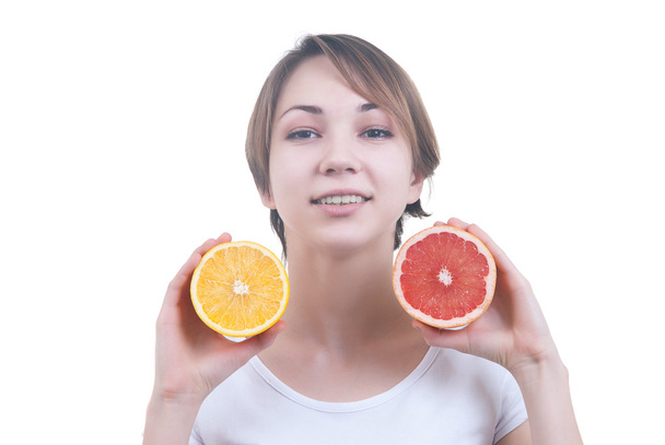 Girl holding the half of lemon and grapefruit - Fotografie, Obrázek