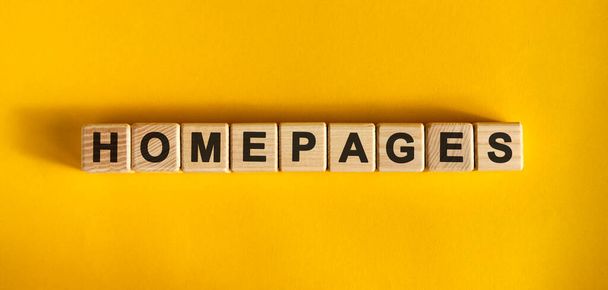 Homepage - large wooden cubes with text on a yellow background - Fotoğraf, Görsel