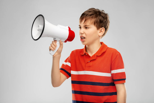 angry boy speaking to megaphone - Foto, Bild