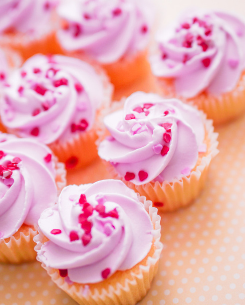 Cupcakes with pink cream and heart sprinkles - Foto, imagen