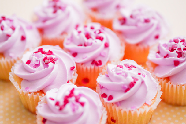Cupcakes with pink cream and heart sprinkles - Zdjęcie, obraz