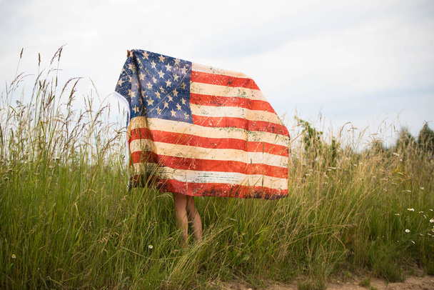 Patriotic holiday. Happy kid, cute little child girl with American flag. - Valokuva, kuva