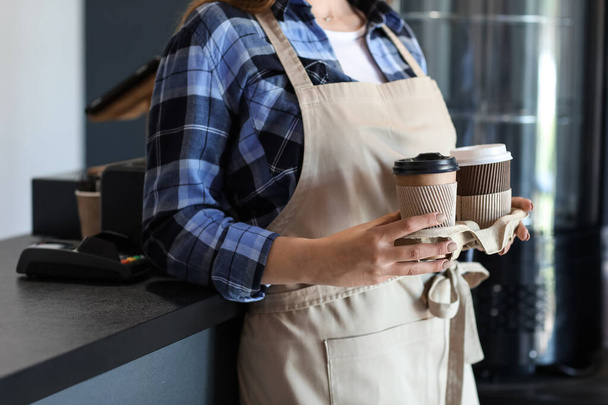Female barista in modern cafe - Fotó, kép