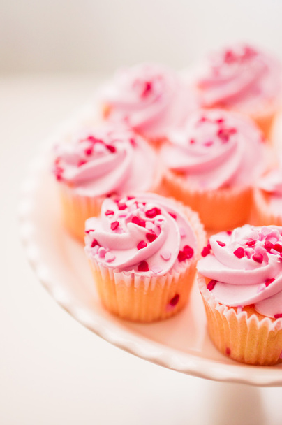 Cupcakes with pink cream and heart sprinkles - Photo, Image