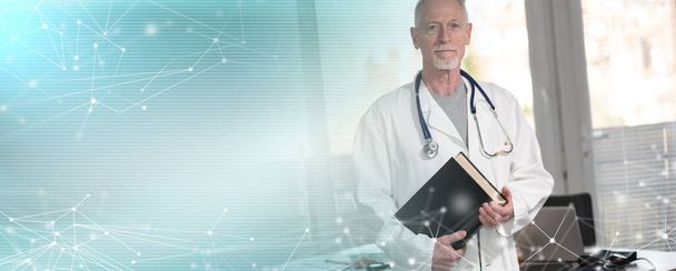 Doctor standing and holding a medical textbook; panoramic banner - Photo, Image