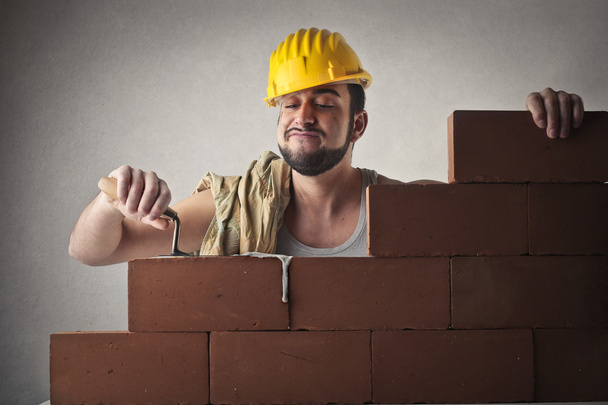 Happy bricklayer working - Φωτογραφία, εικόνα