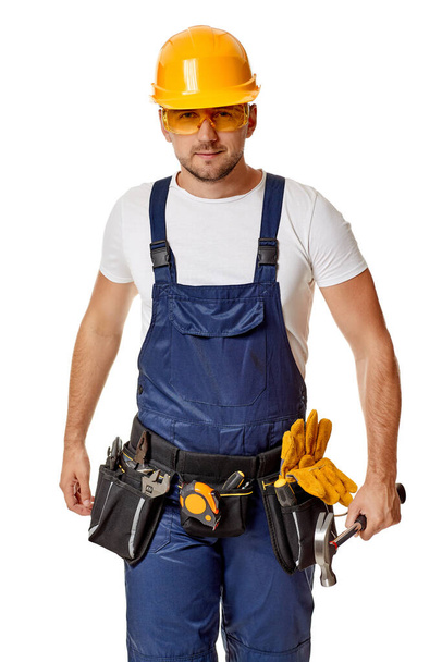 repairman worker in yellow hard hat and uniform. - Foto, Imagem