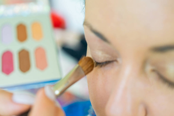 Apply makeup. Makeup artist applying makeup - Photo, Image