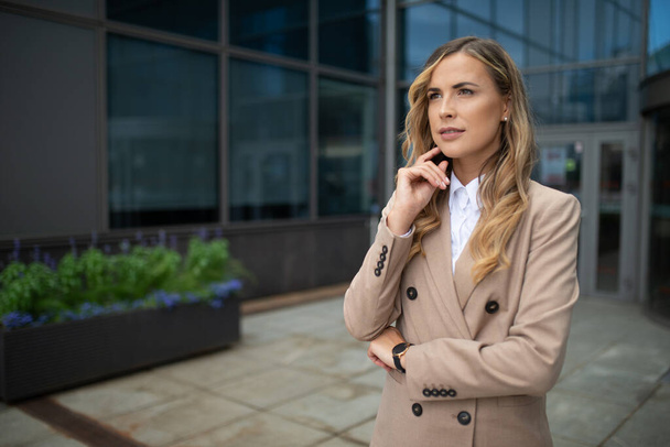 Portrait of a confident businesswoman in front of her office, business people career concept - Fotó, kép
