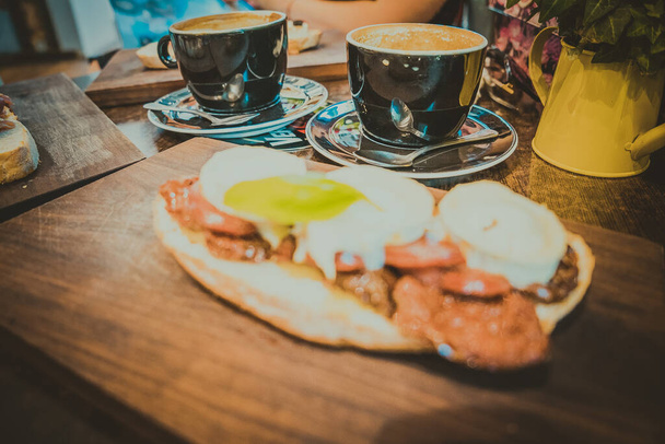 Sandwiches and coffee, breakfast in a cafe - Фото, изображение