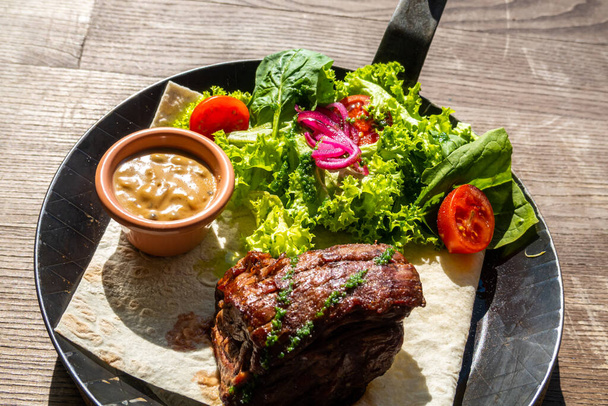 Veal steak on a plate, food background - Fotó, kép