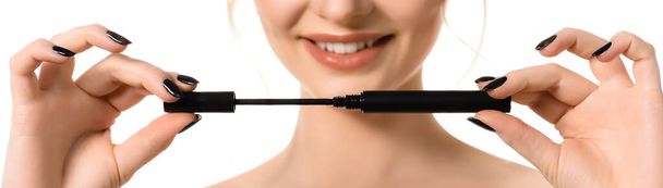 cropped view of smiling naked beautiful woman with makeup and black nails holding mascara isolated on white, panoramic shot - Photo, Image