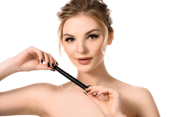 naked beautiful blonde woman with makeup and black nails holding mascara isolated on white - Φωτογραφία, εικόνα