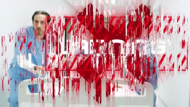 Animation of a red sign with white word WARNING over a view of a group of male and female healthcare workers wheeling a bed with a patient. Coronavirus Covid-19 pandemic concept digital composite. - Кадри, відео