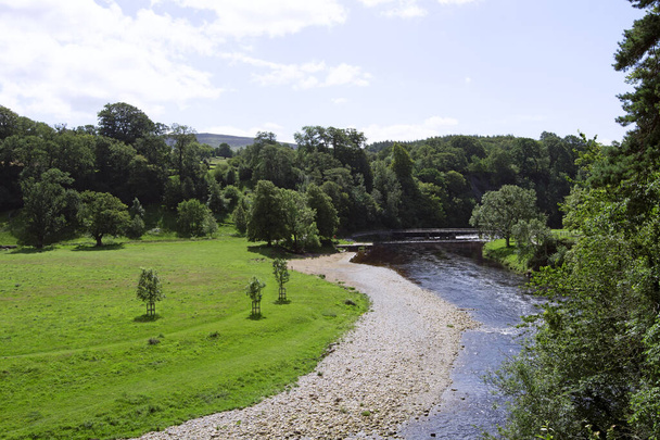 Wharfedale is regarded by many as the jewel in the crown of all the dales in the Yorkshire Dales.  Extremely popular with tourists, it contains awe-inspiring views of gentle undulating hills, the River Wharfe and Bolton Abbey to name but a few. - Photo, Image