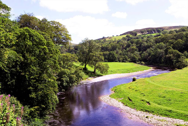 Wharfedale is regarded by many as the jewel in the crown of all the dales in the Yorkshire Dales.  Extremely popular with tourists, it contains awe-inspiring views of gentle undulating hills, the River Wharfe and Bolton Abbey to name but a few. - Photo, Image