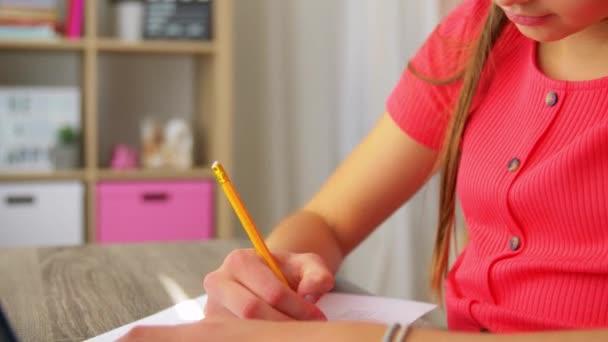 student girl with tablet pc learning at home - Materiał filmowy, wideo