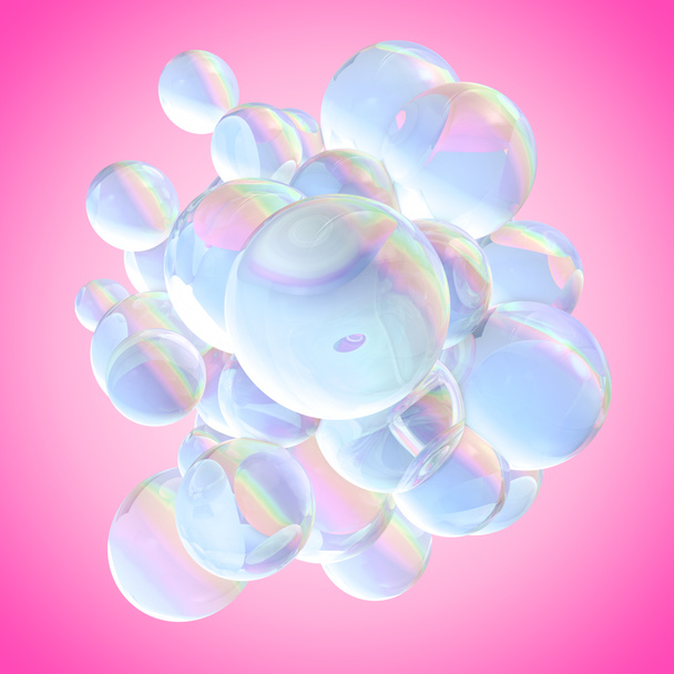 Seifen-Regenbogenblasen konzentriert in der Mitte eines rosa Hintergrund. - Foto, Bild
