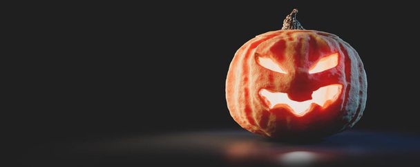 Halloween pumpkin glowing. Jack-o'-lantern scary carved face. - Zdjęcie, obraz