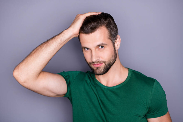 Look silky shine clear hairdo. Charming imposing guy look mirror enjoy his haircare procedure wear green t-shirt isolated over gray color background - Фото, зображення