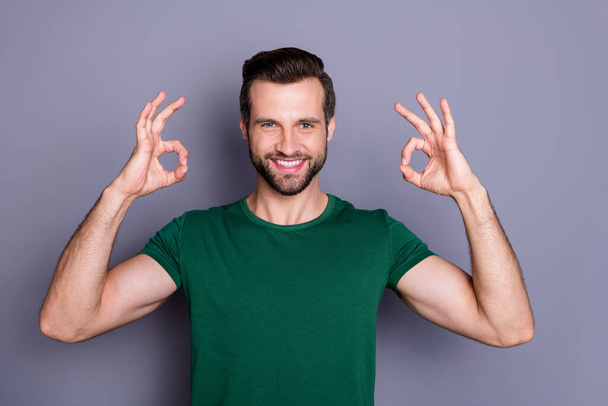 Portrait of positive confident guy promoter show double okay sign enjoy excellent sales adverts promotion wear good look outfit isolated over gray color background - Fotografie, Obrázek