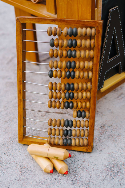 Big Wooden Abacus at Chalkboard Crayon Set Outside - Фото, зображення