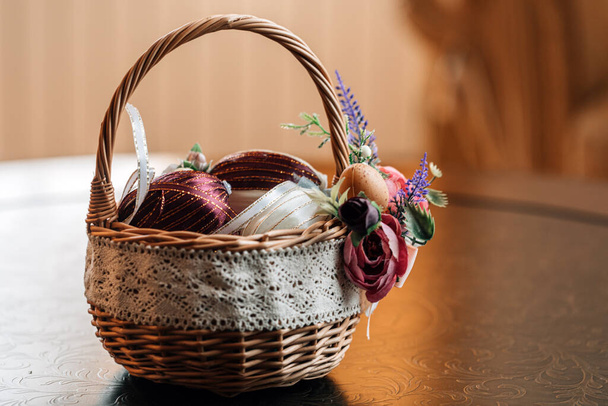 Easter eggs in decorative basket on rustic background. High resulotion image. - Fotografie, Obrázek