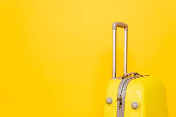 colorful travel bag on yellow background - Zdjęcie, obraz