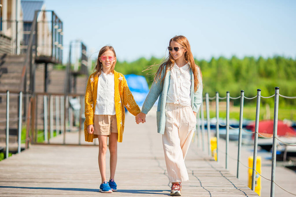 Adorable little girls in port at summer - Fotografie, Obrázek