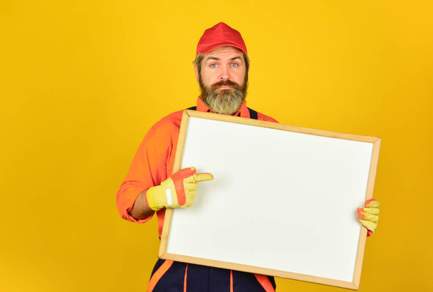 Architect Worker hold Flip Chart. Conference Meeting. person presenting at a flip-chart. Businessman. male construction worker. man with presentation. Builder points to flipchart. copy space - Φωτογραφία, εικόνα