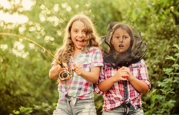 We have caught it. kids spend time in camp. having fun. fish angler. two girls fishing. Big game fishing. summer hobby. happy children with net and rod. summer holidays weekend. Fly Fishing Time - Fotografie, Obrázek
