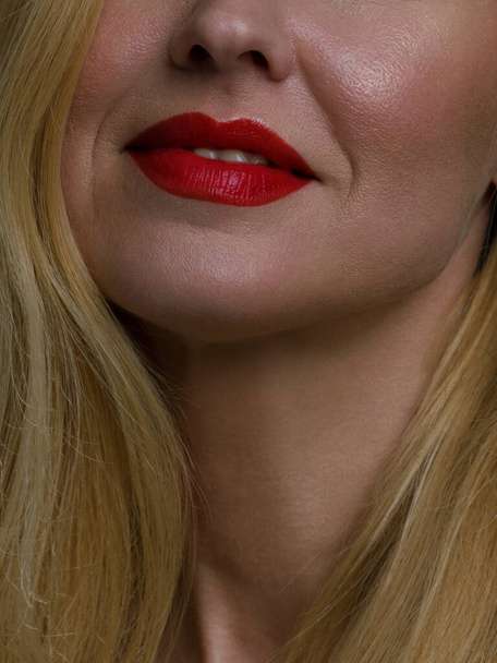 Perfect red lip maqullage. Close up macro cropped photo with beautiful attractive female mouth, wellness, wellbeing, treatment, therapy concept, isolated on grey background - Fotoğraf, Görsel