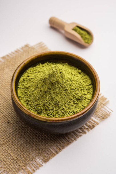 Herbal henna or Mehandi powder in a bowl forming heap, Used for Tattoo or Hair Dye in India - Valokuva, kuva