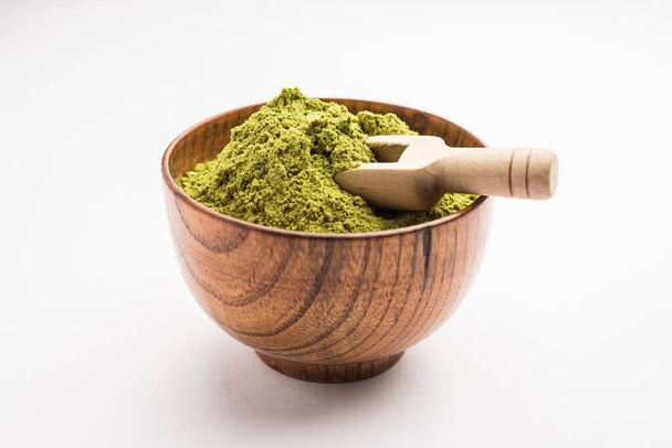Herbal henna or Mehandi powder in a bowl forming heap, Used for Tattoo or Hair Dye in India - Фото, зображення