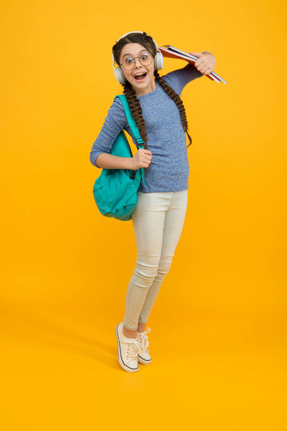 Welcome back to school. Happy child carry backpack yellow background. Little girl back to study. Back to class. School and education. September 1. Knowledge day. Private teaching. Back to school - Fotoğraf, Görsel