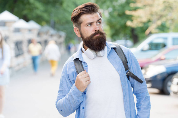 Long beard is style for him. Bearded man travel urban outdoors. Hipster with stylish beard hair. Beard barber. Beard grooming. Skincare. Haircare. Barbershop. Maintaining masculine look - Valokuva, kuva