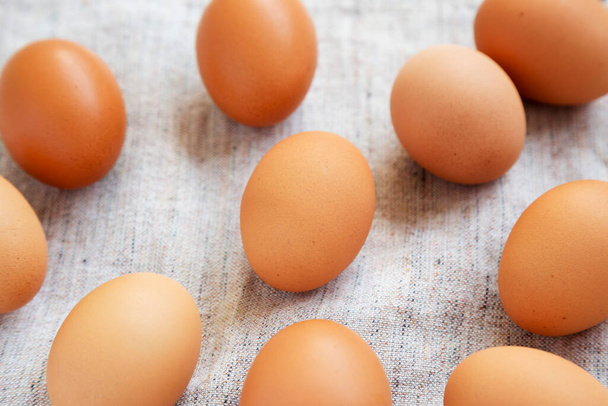 Raw Brown Eggs on cloth, side view.  - Фото, изображение
